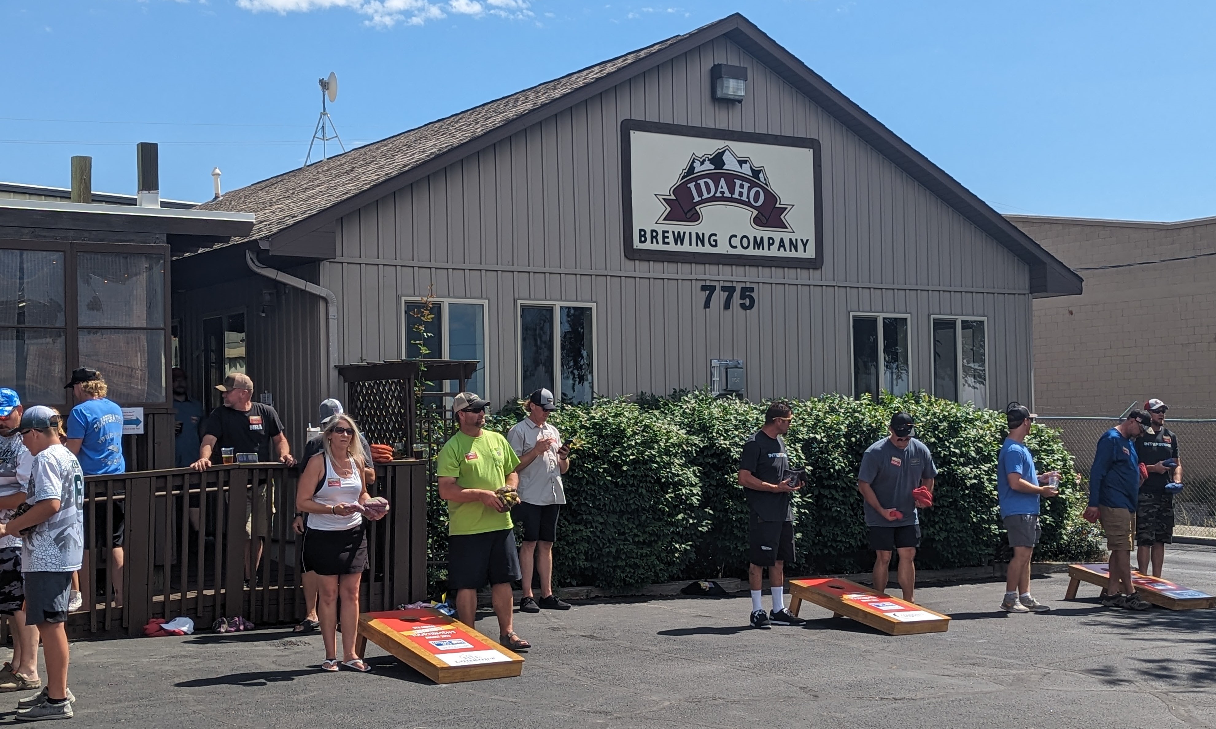 Participants of the cornhole tournament playing.