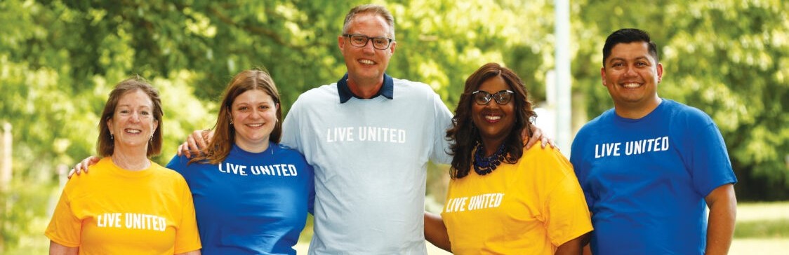 People wearing Live United tshirts.